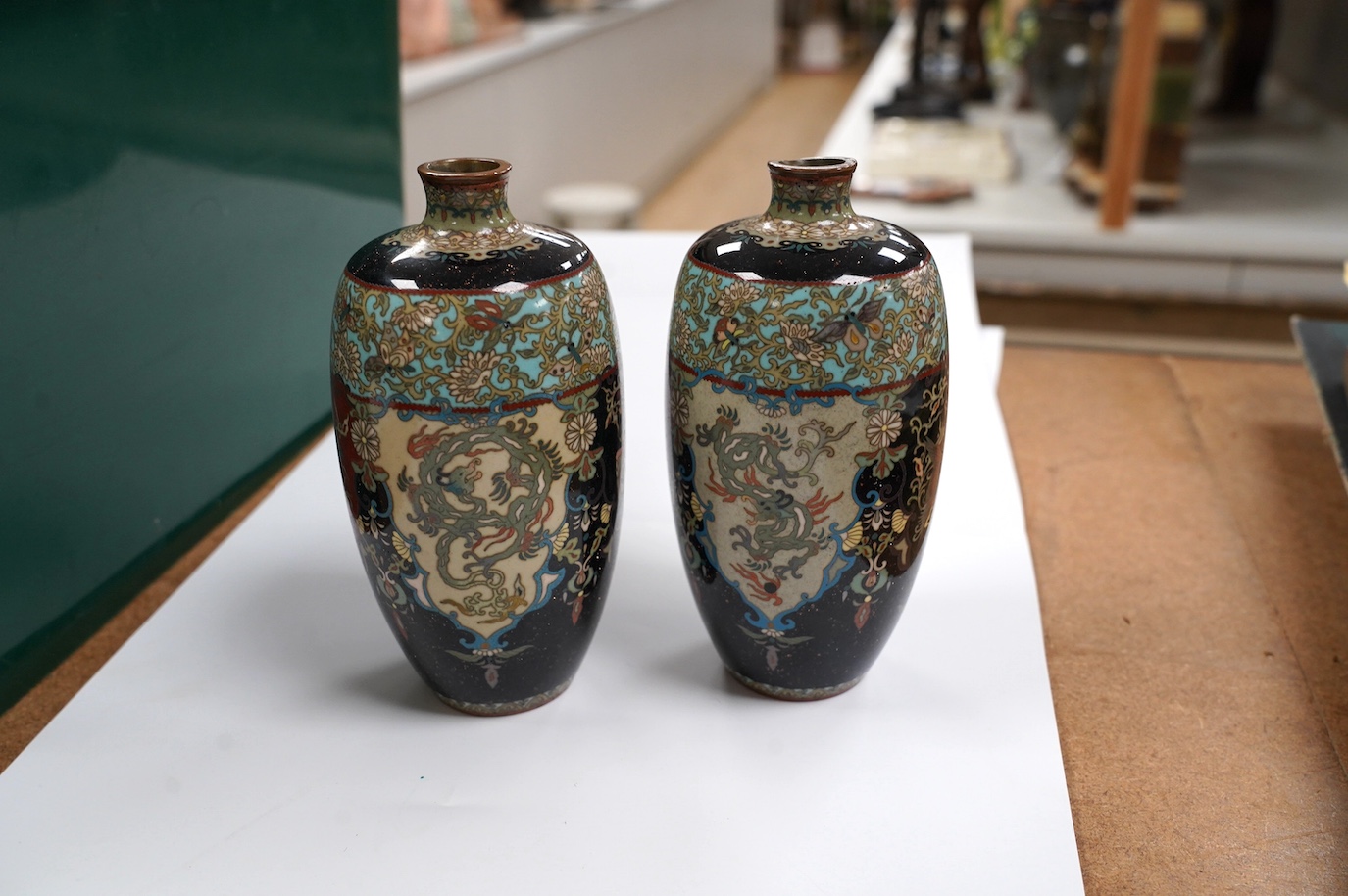 A pair of Japanese cloisonné enamel vases, signed, 14.5cm high. Condition - fair to good